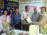 Founder of Gyankosh Publication, Mr. Shahid Hasan Tarafder, is handing over Bangladesh & World Study Book to Writer, Researcher Dr. M Helal. (2012)